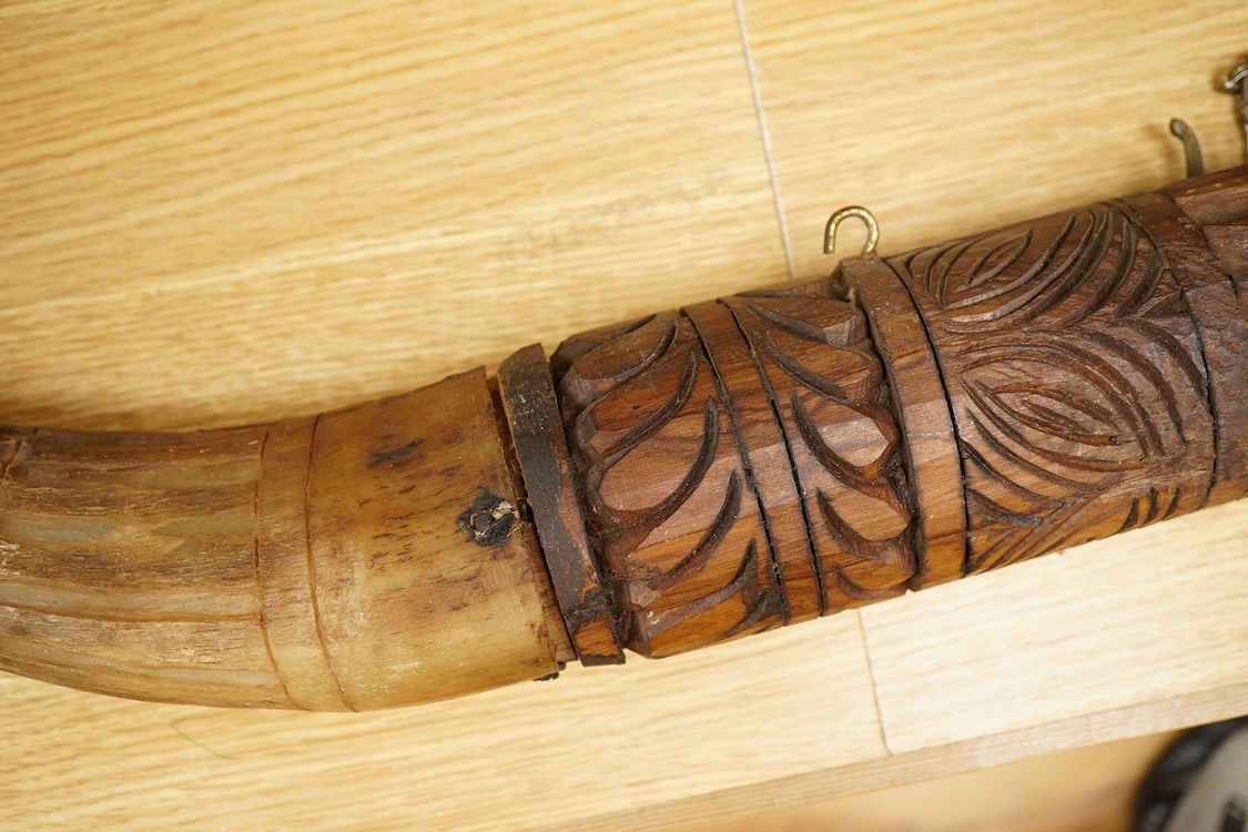 An African carved wood and cow-horn oliphant, 90cm